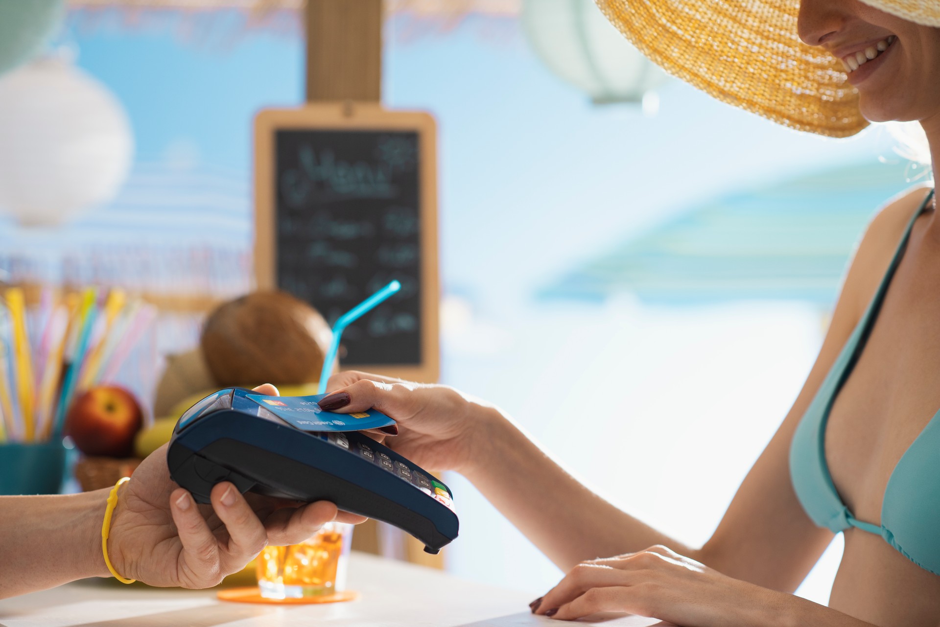 Woman paying using a contactless credit card