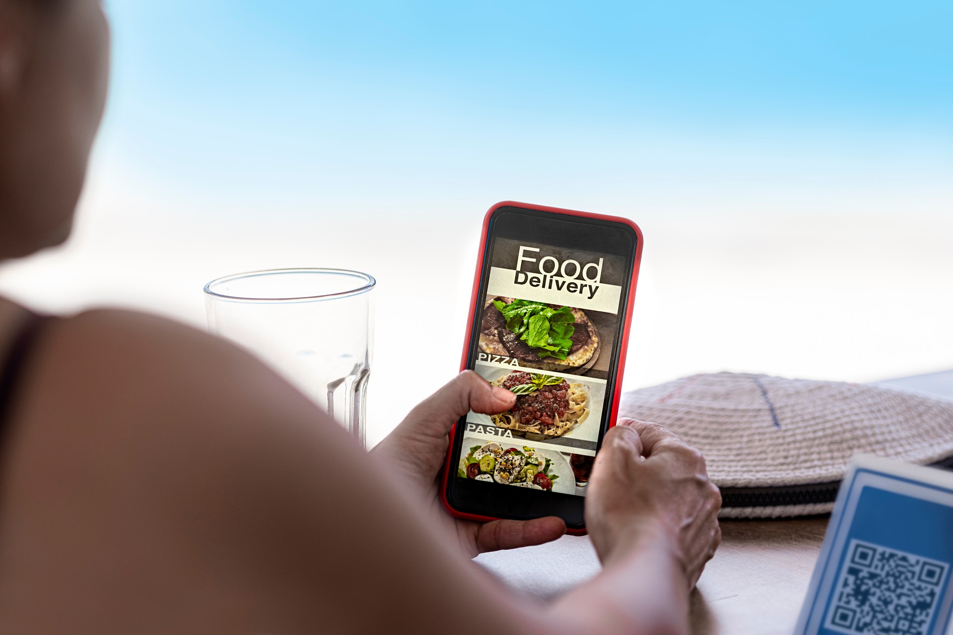 Woman using mobile app to order food.