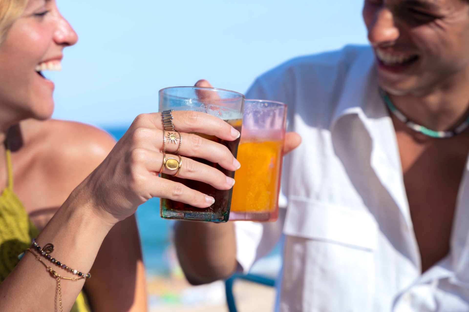 Happy young couple on vacation,drinking in restaurant